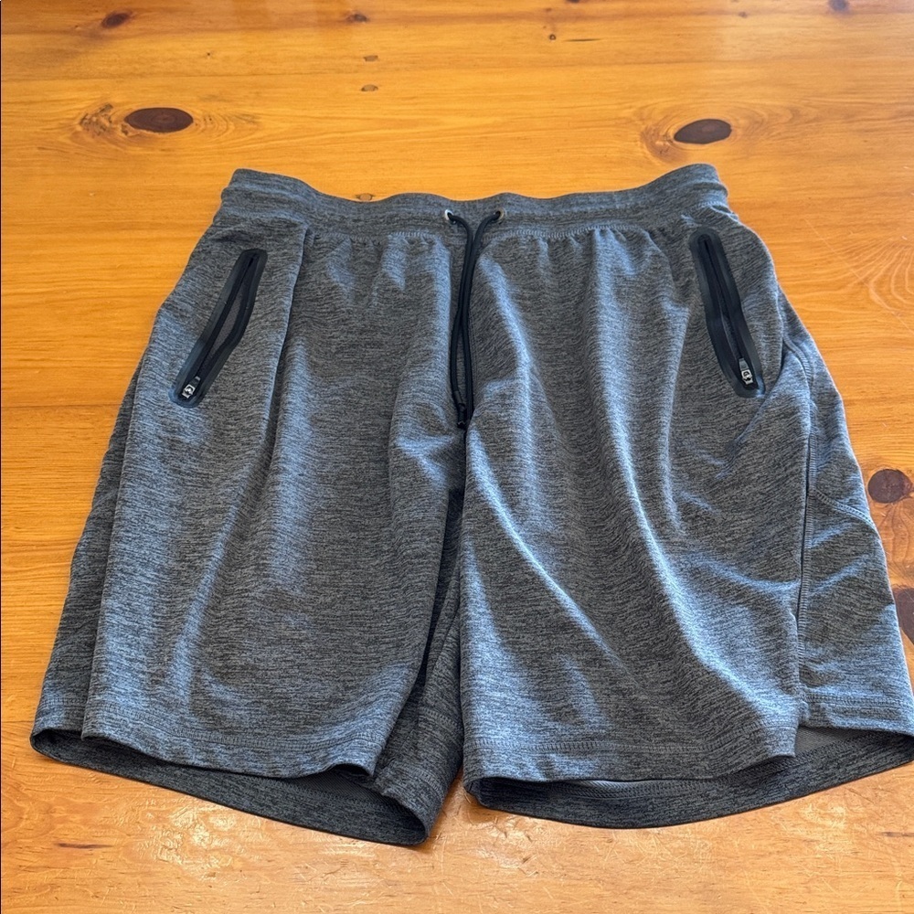 Russell Athletic Men's Athletic Dri Power shorts with zipper pockets.
